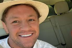 Conor McGregor beams alongside Dee Devlin and kids as they savour heatwave  in classic Irish style