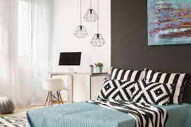 Here, the bedding is placed in the corner of the room while some basic furniture completes it in a very effective arrangement. How To Organize Design A Home Office Guest Bedroom Extra Space Storage