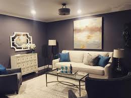 A brighter color blue is brought in through the use of two arm chairs and decor pieces. The Top 47 Living Room Color Ideas Interior Home And Design