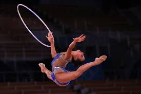 Rhythmic gymnastics is a sport in which gymnasts perform on a floor with an apparatus: U7iho05phekhfm