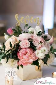 Glittery Numbers Great Diy Table Centerpiece Ideas Flower Centerpieces Wedding Wedding Floral Centerpieces Wedding Table