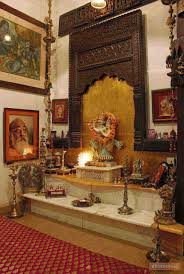 Indian Style Hanging Lamps An Elegant Puja Room With Marble Floor And Hanging Bells And Idols Pooja Room Design Temple Design For Home Pooja Room Door Design
