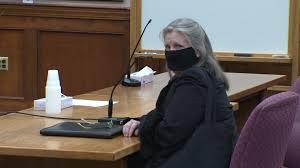 Woman accused of pulling gun over social distancing sign