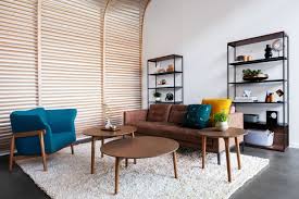 It has a smooth, laminate top and black metal, open frame legs. Sly Tables
