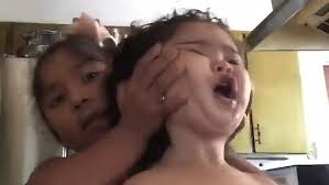 Video Little Girl Picks Up Her Baby Sister By The Head In Hilarious Video Daily Mail Online