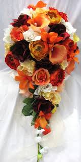 A simple gathering of red and orange roses accented with purple statice and orange mini gerberas creates a beautiful fall wedding bouquet. Wedding Bouquet Bridal Set 2pc Callas Orchids Ranunculus And Roses Red Orange Yellow Ivory Wedding Bridal Bouquets Wedding Bouquets Wedding Bouquets Bride