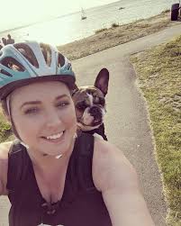 Riding bike with dog after weekend getaway
