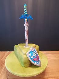 How to make cake guide for zelda breath of the wild shows where to find ingredients for cake recipe, how to complete a parent's love quest. Zelda Breath Of The Wild Master Sword And Triforce Shield Birthday Cake Zelda Cake Zelda Birthday Cake Decorating