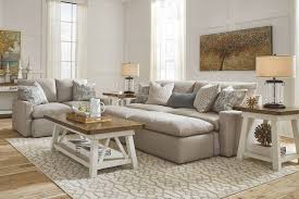 The Melilla Ash Sofa Loveseat 2 Ottomans Stownbranner Cocktail Table 2 End Tables Sold At Bailey Mattress Furniture Furniture Farmhouse Decor Living Room