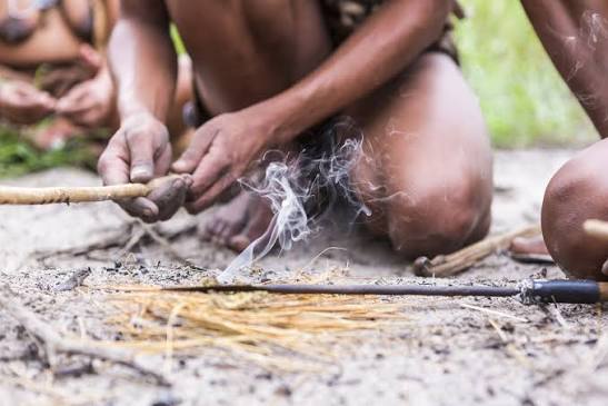 San Bushmen tracker demonstrating traditional skills in the Kalahari
