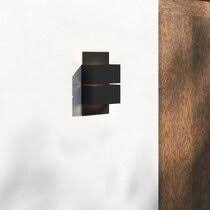 Features a photocell and a powerful led array for maximum energy efficiency. Modern Outdoor Wall Lighting Allmodern
