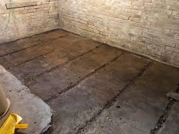 The idea just to lay a carpet on a basement floor can shock some people, but its heat and the wide range of stylistic decisions along with a price variety does such material as the. Why Is My Basement Floor Like This Tore Up Layers Of Carpet And Linoleum Then A Layer Of Rotted Wood Planks To Find Strips Of Concrete And Dirt Whatisthisthing