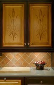 Once the joint compound dries, you lightly sand the raised edges caused by the putty knife, then paint the cabinet door. 23 Cabinet Stencils Ideas Stencils Cabinet Stencil Furniture