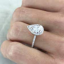 This brilliant engagement ring features four marquise diamonds (approx. Pear Shaped Or Teardrop Diamonds Ascot Diamonds