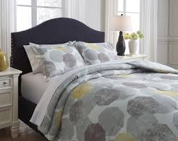 Your bed and bedroom as a whole tend to look well put together and organised when things match browse our lovely selection of bedding sets to find an array of colours, materials and designs to suit. Gastonia Gray And Yellow Comforter Set By Signature Design By Ashley Furniturepick