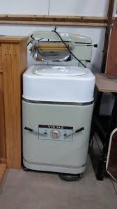 Two old wringer washing machines sit side by side at a junk yard in this digtially enhanced original photograph titled all washed up by me, rebecca korpita. Vintage Viking Wringer Washing Machine Great West Property Auctions