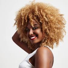 Heard's honey blonde spirals make her fair skin pop—if you're a natural blonde consider taking your hue up a couple shades near the roots for the same effect. 7 Blonde Afro Ideas For The Bleach Happy Curlfriend
