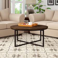 Llona white marble look round coffee table by euro style eurway how to style a round coffee table 3 ideas tidbits to style a round coffee table in your living room the diy play modern style white round drum coffee table hollow interior storage with brown top 1 piece to style a round coffee table in your living room the diy play. Gracie Oaks Hensley Cross Legs Coffee Table Reviews Wayfair