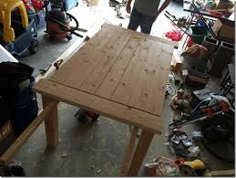 An amish built drop leaf table set has hinged leaves on either end that extend upwards. Diy Farmhouse Table With Extension Leaves With Plans Sweet Tooth Sweet Life
