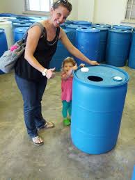 Next, use a hole saw to cut out a hole for overflow at the top of the barrel on the left side (image 4). Earth Day 2013 Making A Rain Barrel Crunchy Hot Mama