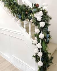 Attaching garland to the house???? 15 Festive Christmas Staircase Decor Ideas