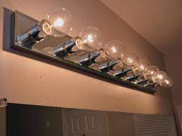 The fixture she shows in the picture requires 8 bulbs. How To Replace A Bathroom Light Fixture How Tos Diy