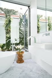 Browse bathroom designs and decorating ideas. A White Bathroom With Its Own Courtyard White Marble Bathrooms Marble Bathroom Ensuite Bathroom Designs