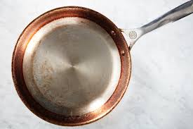 Keep in mind that higher temperatures will help loosen any caked on grease, so warm water won't work as well here. How To Clean A Greasy Dirty Skillet Epicurious