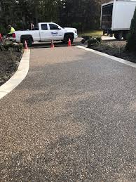 I love the looks of that exposed aggregate driveway, but i am concerned about the problem you described, where pocket of ice and salt can loosen or deplete the stones. Exposed Aggregate Bomanite