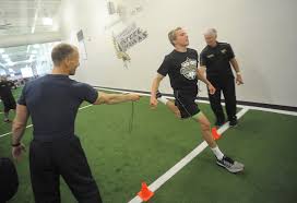 High school football players test skills at pro-style combine