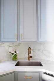 small gray kitchen with corner sink and