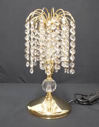 Crafted with a moulded glass base and gold aluminium and black glass top, the table adds grandeur and elegance to your home. Table And Floor Lamps Asfour Crystal Hilight Crystal Australia