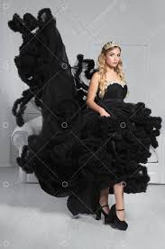 1 853 546 просмотров 1,8 млн просмотров. Lovely Young Blonde Poses In A Studio Dressed In A Black Puffy Evening Dress And Crown Image Stock By Pixlr