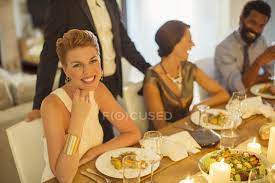 Warble entertainment agency have loads of unique wedding entertainment ideas available to hire anywhere in the uk. Woman Smiling At Dinner Party African Ethnicity Entertainment Stock Photo 199374180