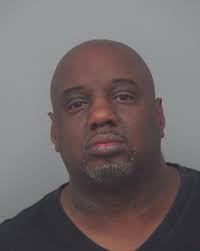 Lilburn police stop two men who were illegally dumping used tires near  retention pond