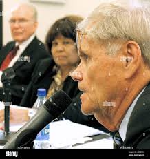 Lyle Reid, right, speaks as Rosetta Miller-Perry, center, and Ben Atchley  look