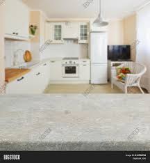 The table is a pedestal round and comes with four chairs. Empty Kitchen Stone Image Photo Free Trial Bigstock