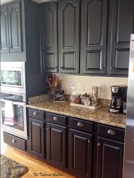 You can't even tell they are the same cabinets. Cherry Kitchen Cabinet Makeover Black Painted Kitchen Cabinets How To Paint New Kitchen Cabinets Cherry Cabinets Kitchen Painted Raised Panel Kitchen Cabinets