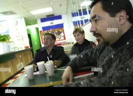 From left to right, President of the Salvadoran Olympic Committee Benjamin  Rodas, Salvadoran President Francisco Flores, President of COSSAL Enrique  Molins and Salvadoran athlete Jorge Gonzales stand next to the Olympic flame