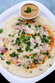 Thin onion dosa topped with finely chopped onions served with sambar and coconut chutney