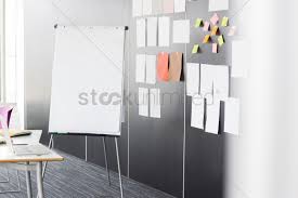 Flip Chart By Sticky Notepapers On Wall In Office Stock