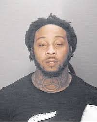 One of three charged with murder and robbery arrested