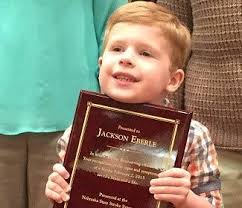 Young boy honored at Stroke Symposium