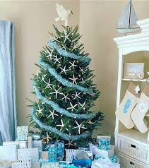Go big with your holiday decor by turning a beach ball into an ornament. The Most Awesome Coastal Christmas Trees Coastal Decor Ideas Interior Design Diy Shopping