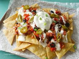 Avoid soggy nachos by briefly baking them before topping with cheese, seasoned beef, refried beans, guacamole, and salsa. Nachos With Salsa Cheese Sauce Food Fusion