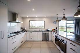 They absorb the light and. Kitchen With U Shaped Stainless Steel Benchtop And Large Peninsula Bench Modern Kitchen Auckland By Mastercraft Kitchens New Zealand Houzz