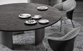 Round shapes can tuck easily into a sectional's corner, while rectangular tables can set boundaries within a room. Wedge Dining Tables En