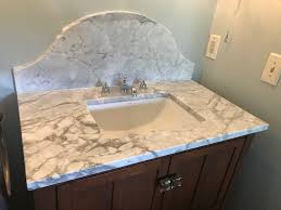 Protect the walls in your kitchen and baths with one of these. Carrera Marble Vanity With Custom Backsplash Blog