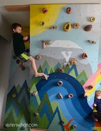Building your own rock climbing wall at home is one of the most effective ways to improve both skill and strength. Diy Kids Inside Rock Climbing Wall With Mural Sisters What
