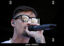 Kyle Pavone of We Came as Romans performs during the Vans Warped Tour at  the Klipsch Music Center